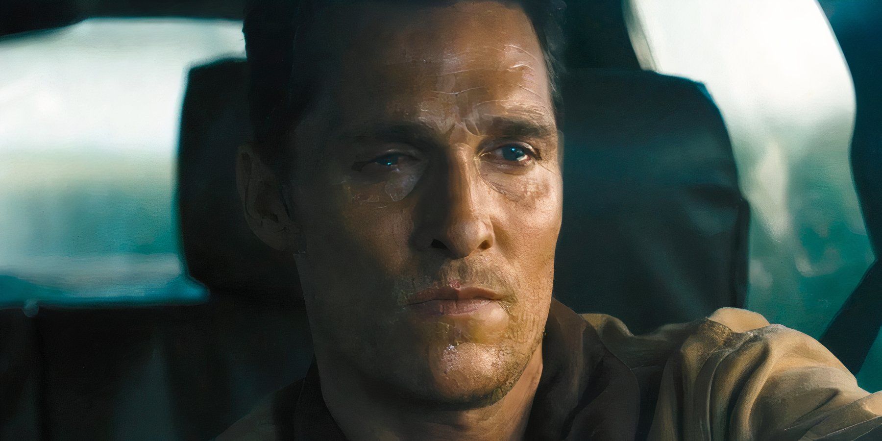 Cooper fights back tears as he drives away from his home in Interstellar.