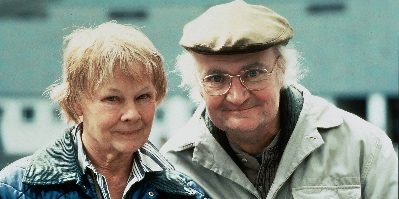 Older Iris Murdoch and John Bayley smiling for the camera in Iris