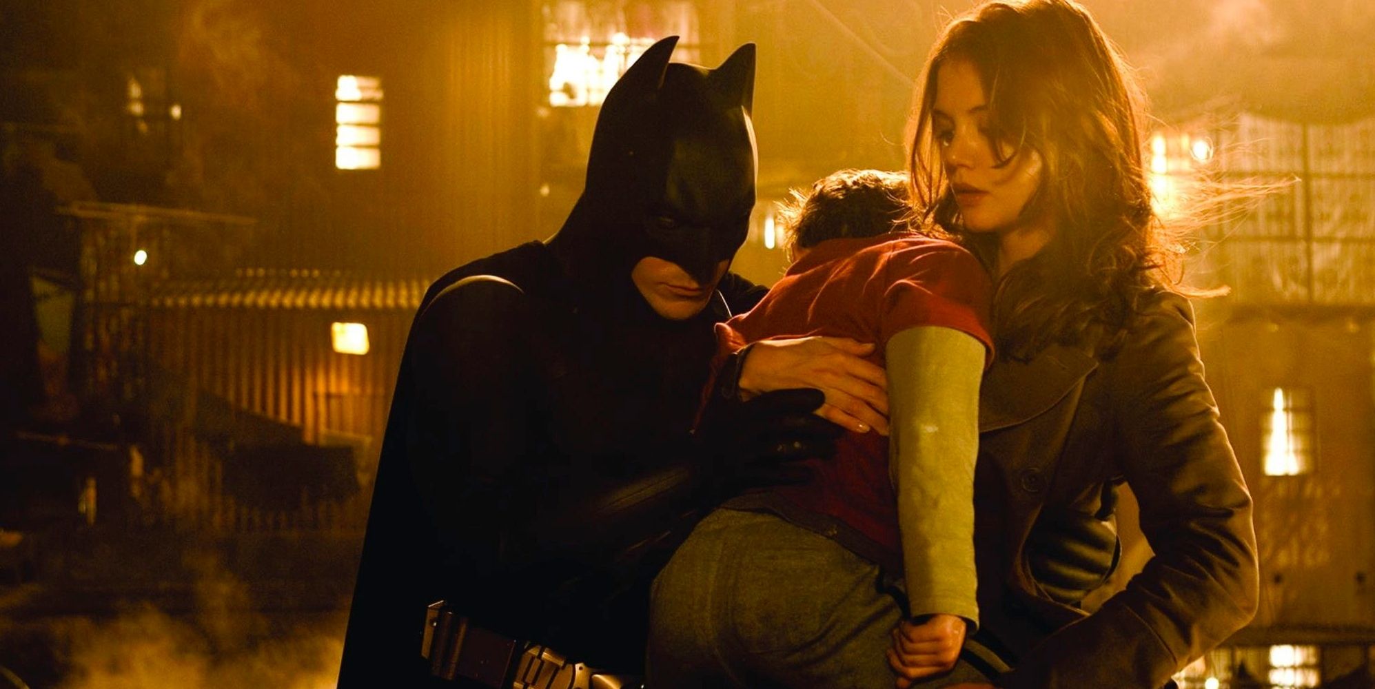 Batman rescuing a small boy in 'Batman Begins'