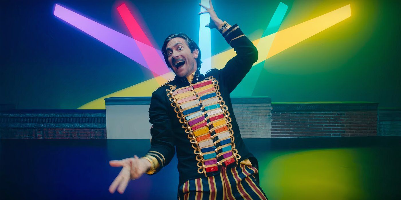 Jake Gyllenhaal as Mr. Music posing & smiling maniacally in 'John Mulaney & the Sack Lunch Bunch'