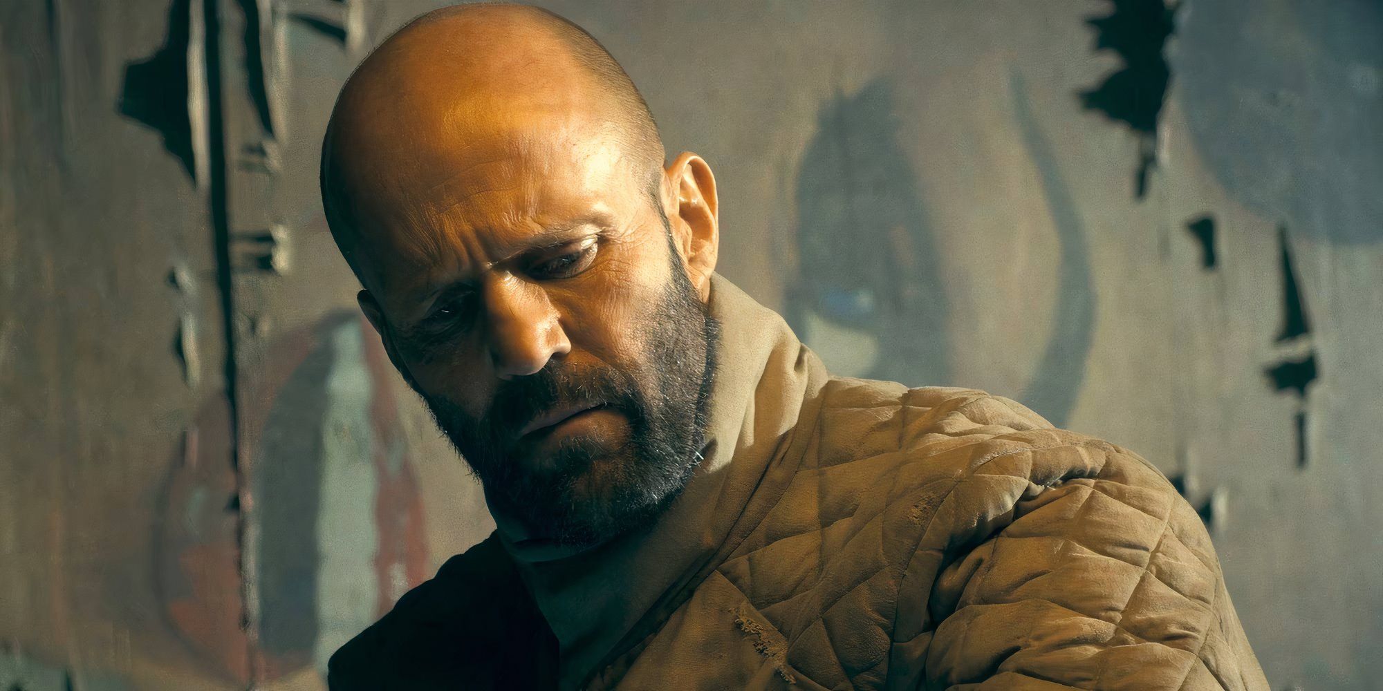 Jason Statham as Adam Clay in The Beekeeper looking confused.