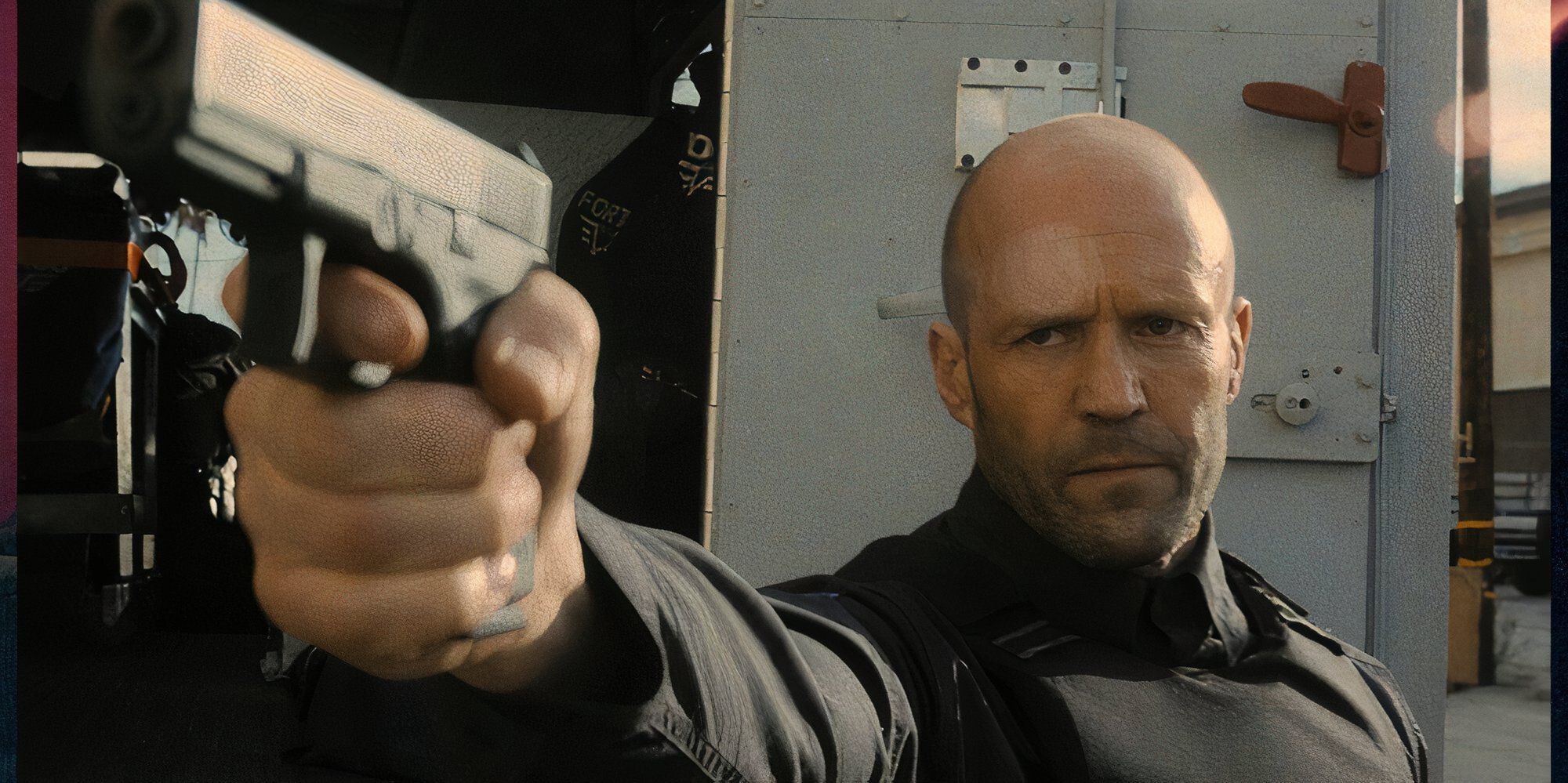 Jason Statham as H in Wrath of Man pointing a gun at someone off-camera.