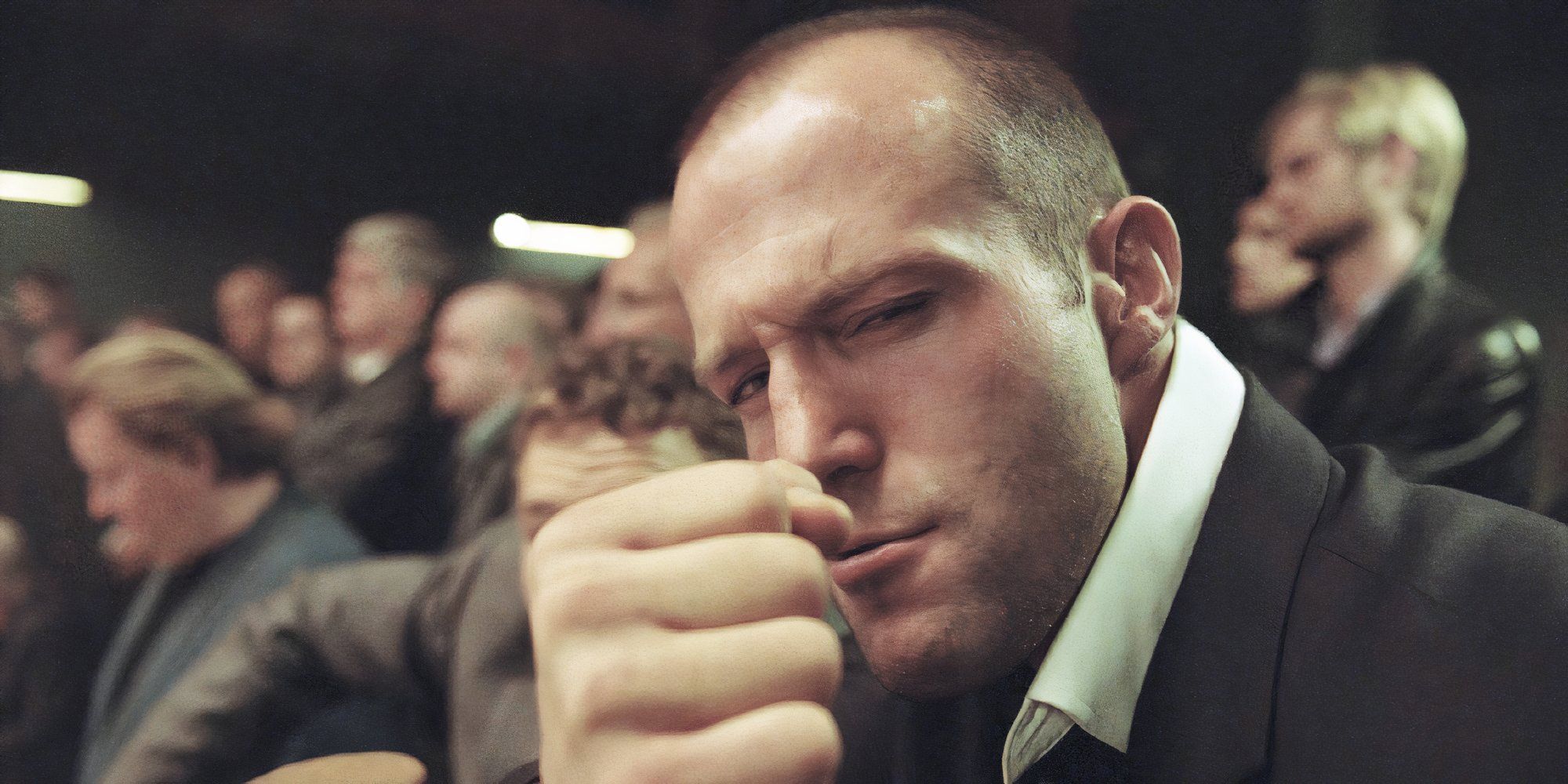 Jason Statham as Turkish in Snatch giving a fist bump while looking at the camera.