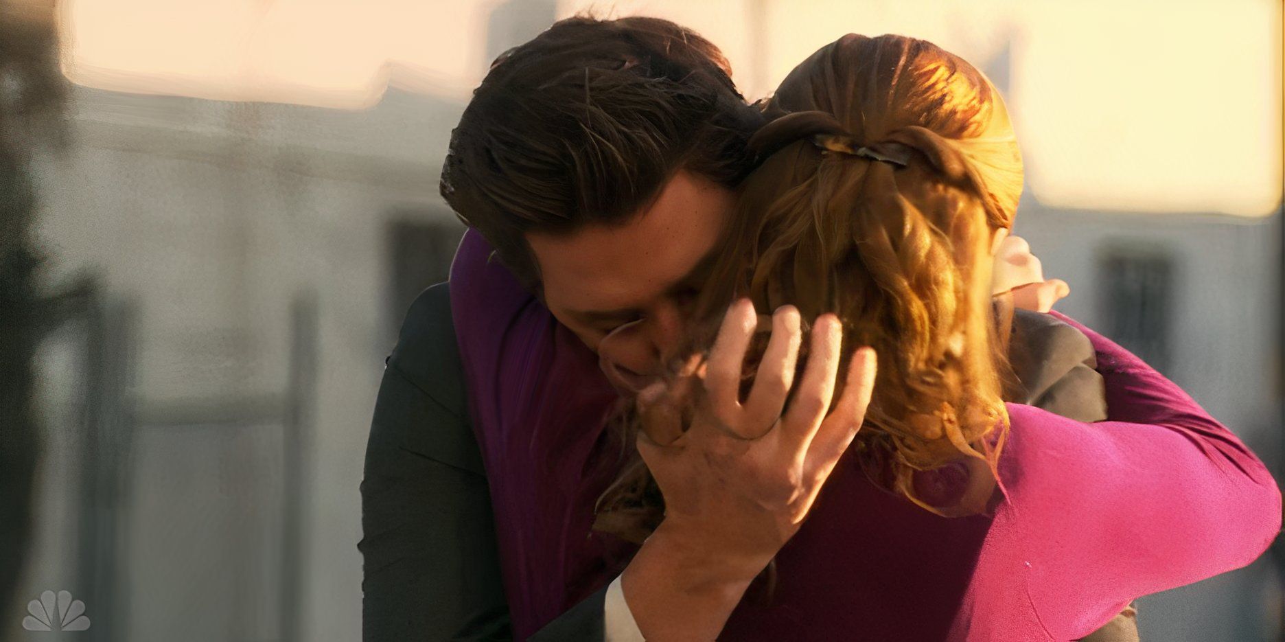 Jim and Pam hugging in the office 
