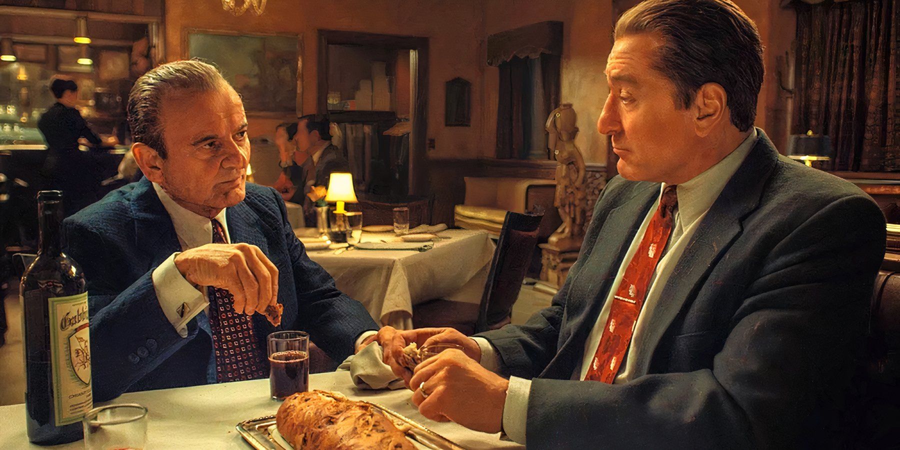 Russell Bufalino and Frank Sheeran share a conspiratorial dinner together in The Irishman.