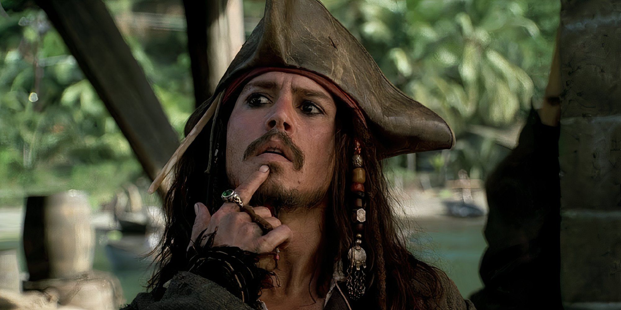 Johnny Depp as Jack Sparrow in Pirates of the Caribbean The Curse of the Black Pearl looking pensive