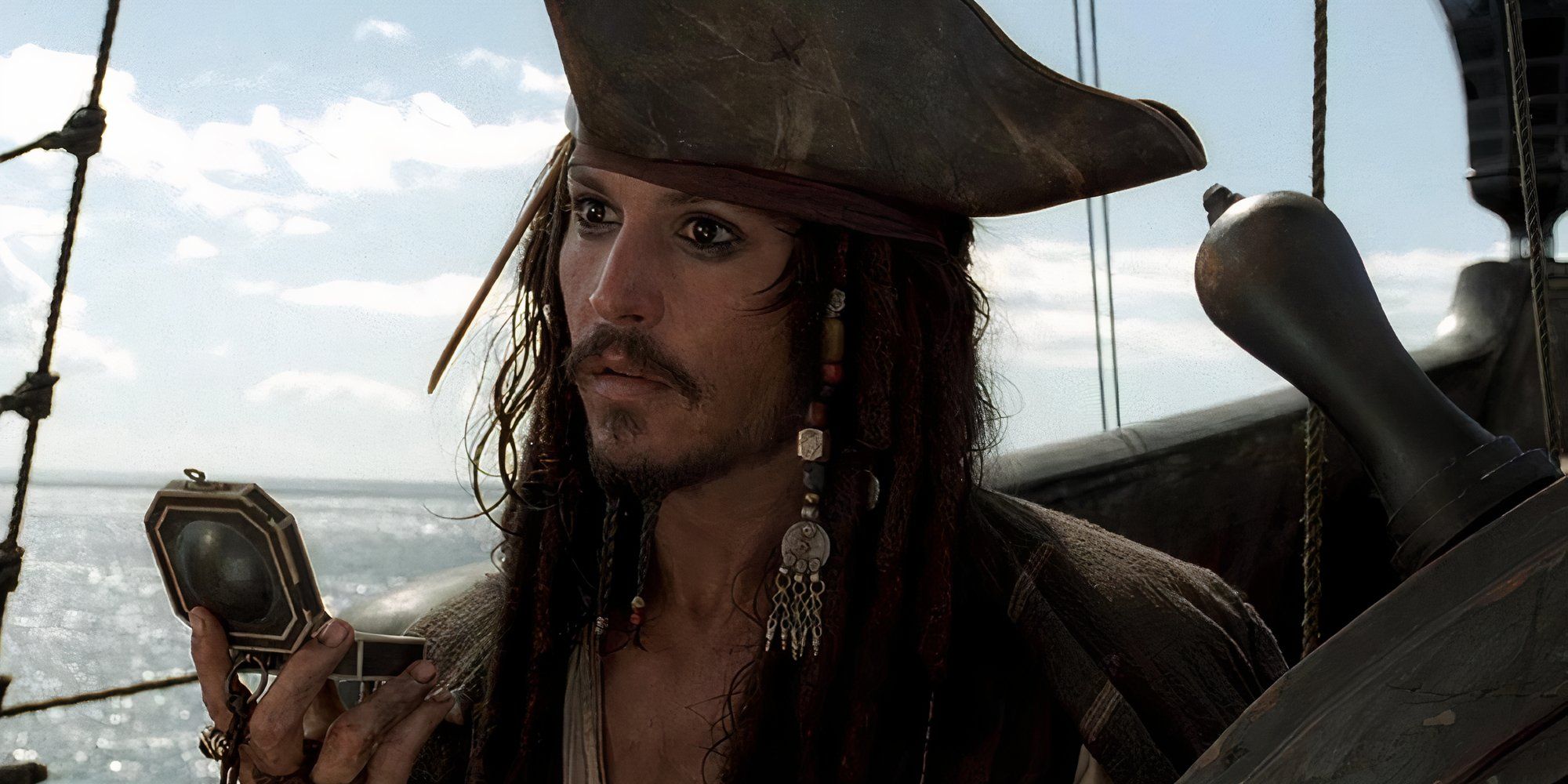 Johnny Depp as Jack Sparrow looking at the horizon in Pirates of the Caribbean The Curse of the Black Pearl