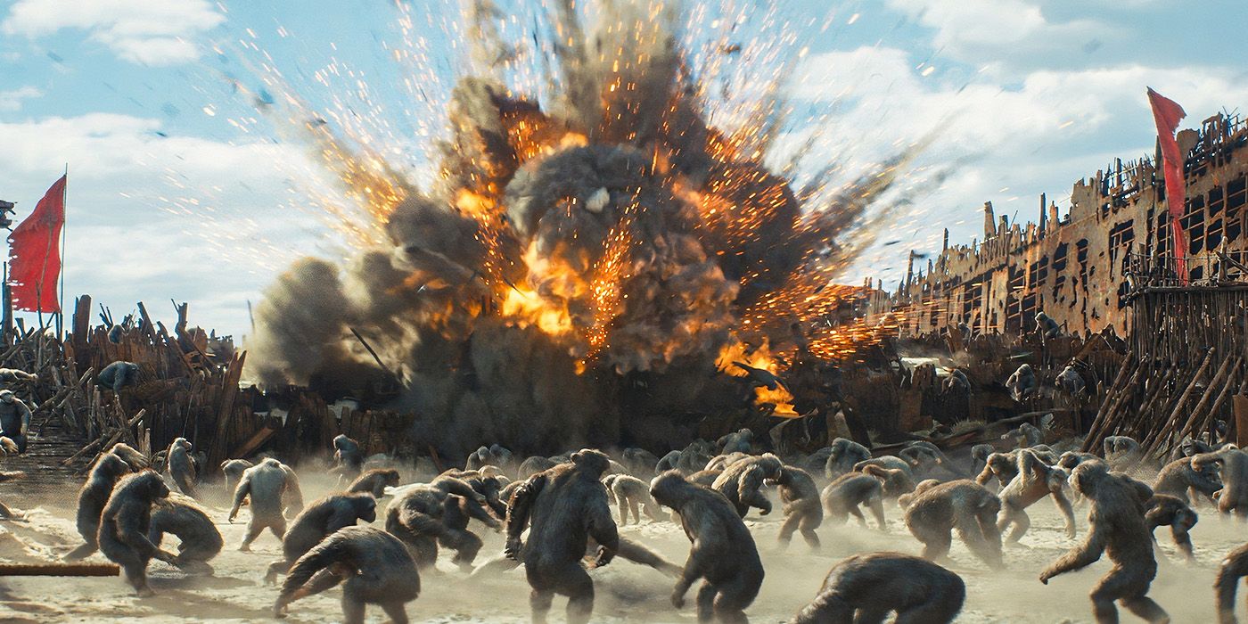 Apes turn to look back at a large explosion on a beach near a rusted ship in Kingdom of the Planet of the Apes