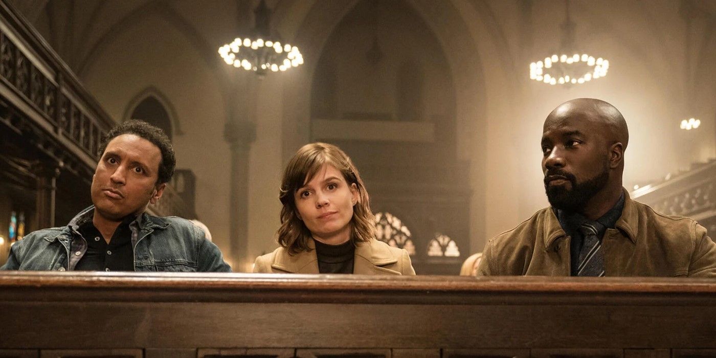 Kristen (Katja Herbers), David (Mike Colter) and Ben (Aasif Mandvi) sit together in the front pew of the church in Season 3 of 'Evil'