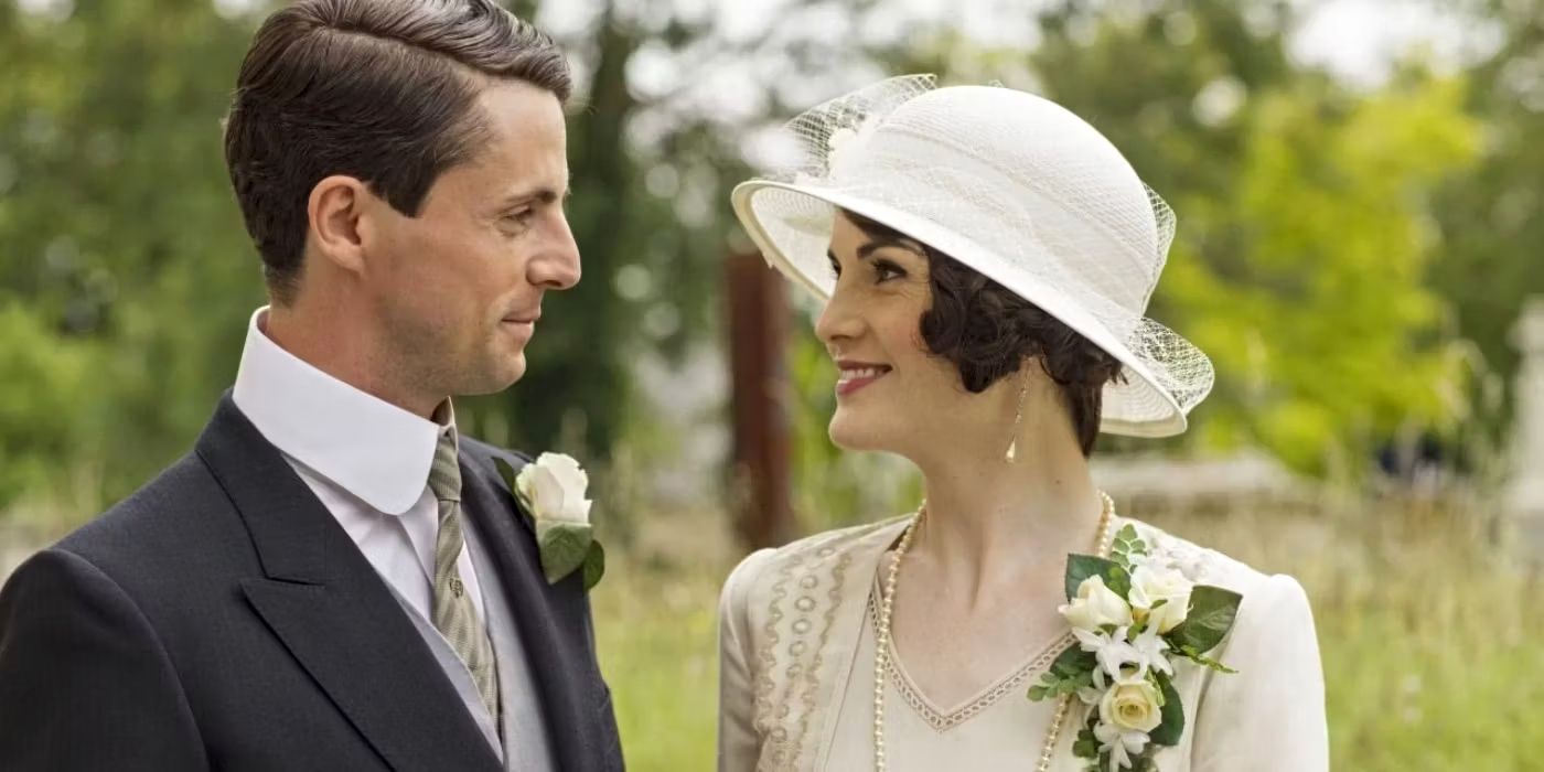 Michelle Dockery and Matthew Goode as Mary Crawley and Henry Talbot, smiling at each other on their wedding day in Downton Abbey