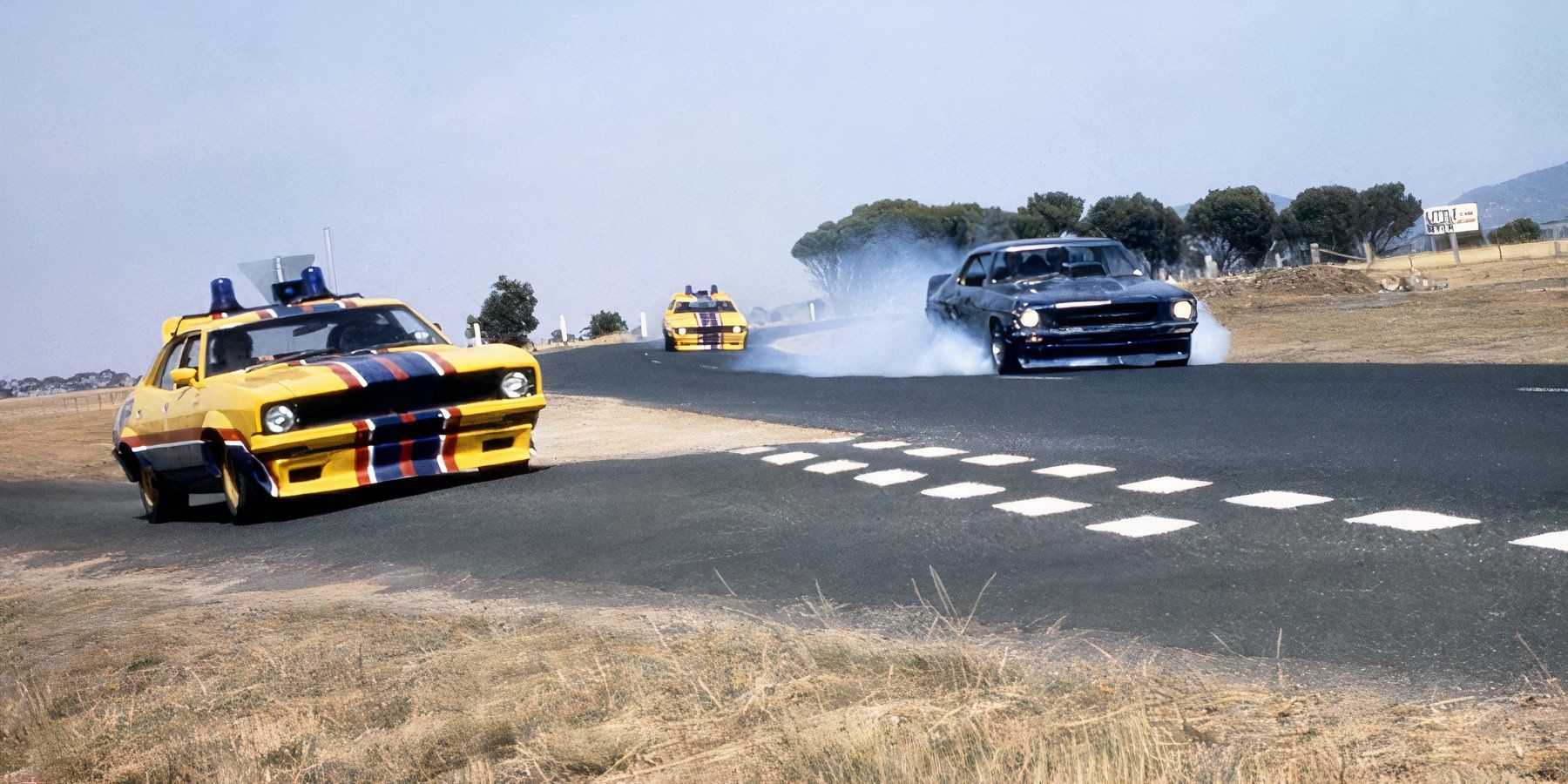Two cars race in Mad Max