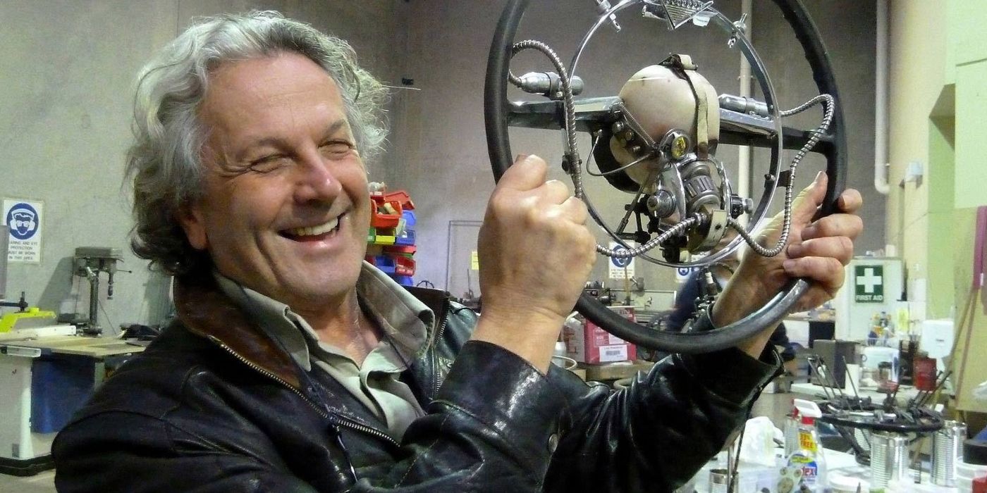 George Miller smiling on the set of Mad Max: Fury Road