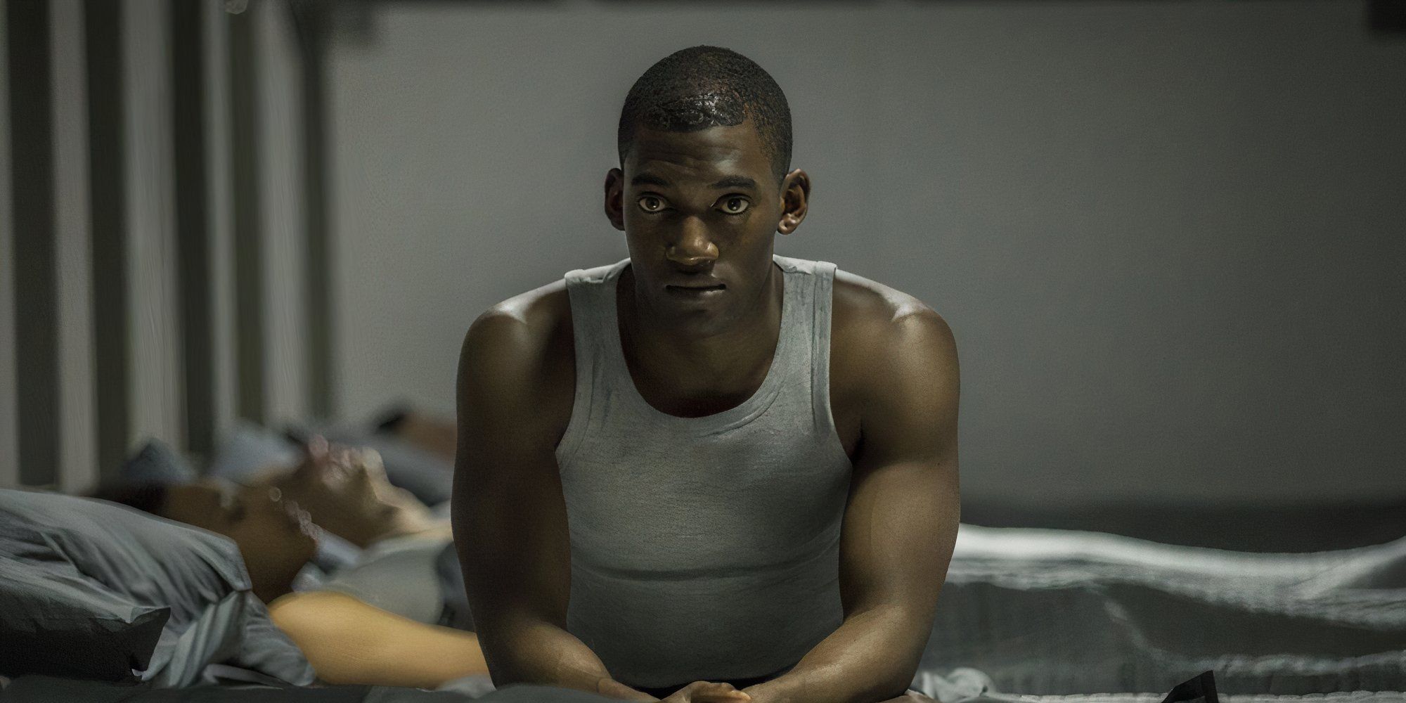 Malachi Kirby as Stripe in Black Mirror's Men Against Fire sitting down.