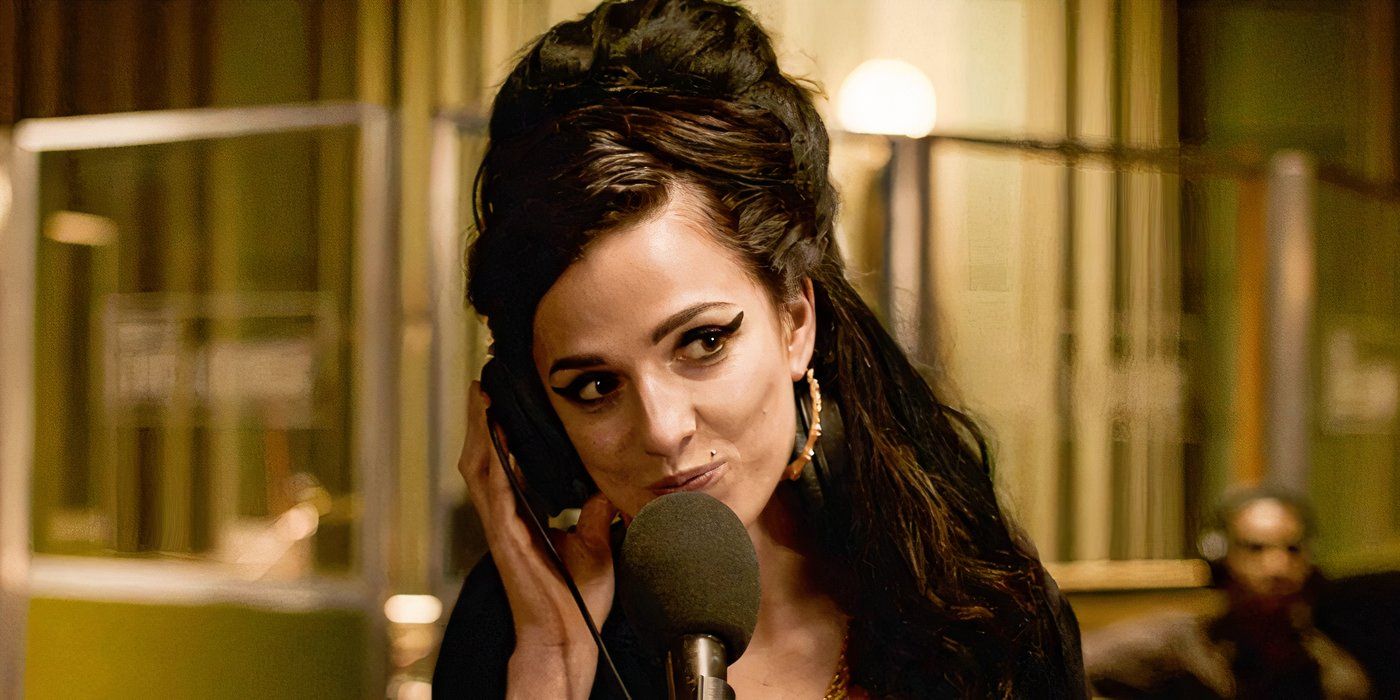 Marisa Abela as Amy Winehouse with headphones on recording a song in the studio.