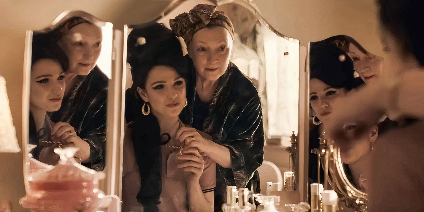 Marisa Abela with Amy Winehouse's signature beehive hairstyle sitting in front of a mirror with Leslie Manville behind her.