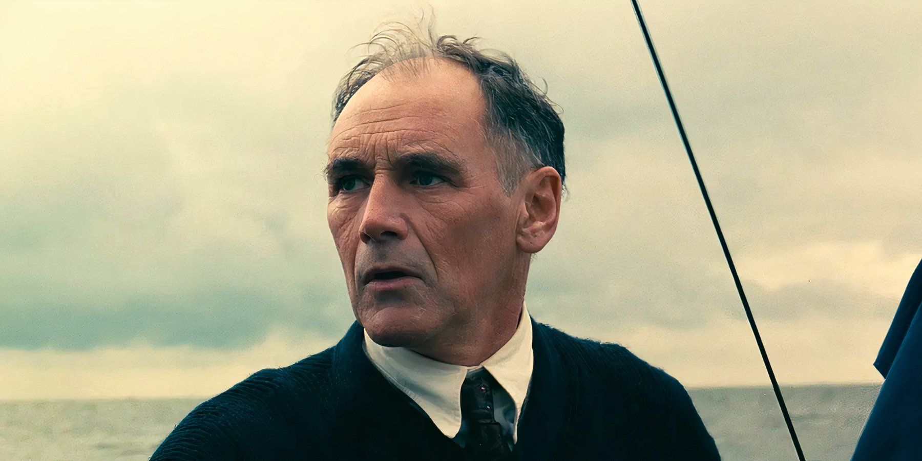 Mr. Dawson stands on his boat, windswept and concerned in Dunkirk.