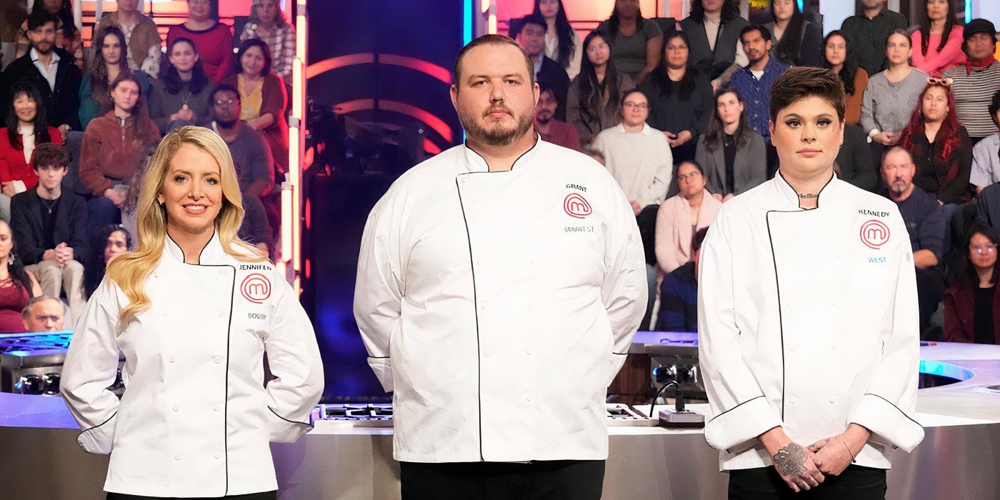 Three contestants from Masterchef wearing white jackets and standing in front of the judges.