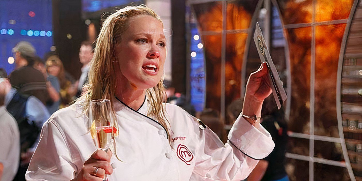 A close-up of Jennifer from Masterchef holding a glass of champagne and a cheque.