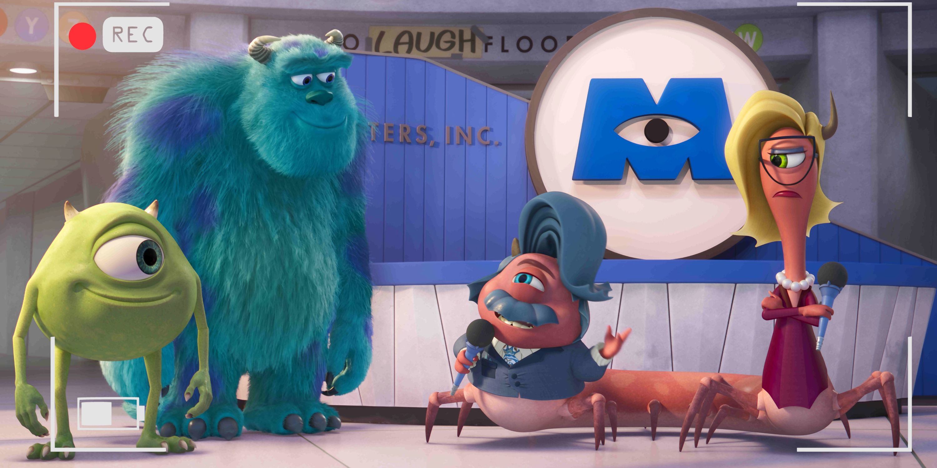 Mike Wazowski and Sulley standing with two other monsters in the Laugh Factory in Monsters at Work Season 2