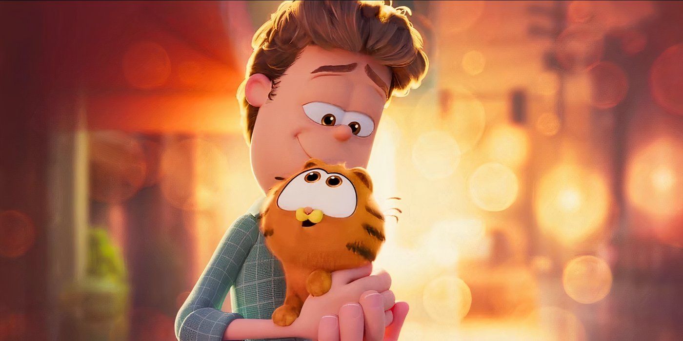 Jon holding a baby Garfield in The Garfield Movie
