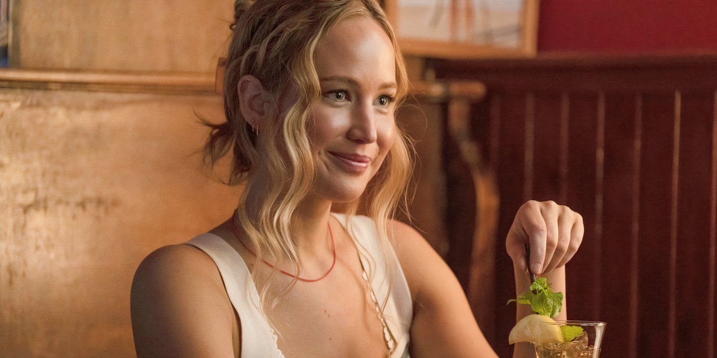 Jennifer Lawrence as Maddie smiling with a drink in No Hard Feelings