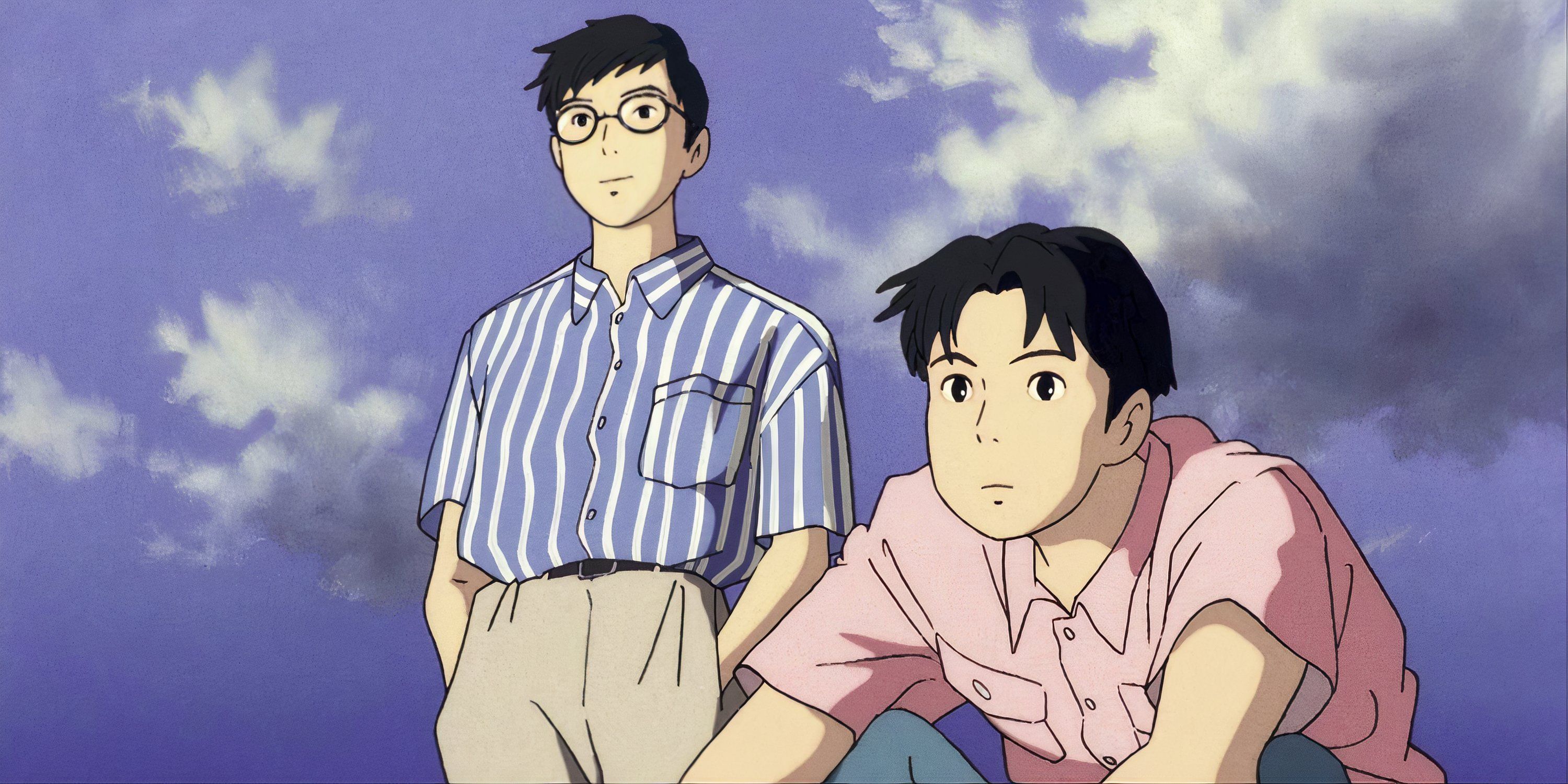 Two men looking at something off-camera in Ocean Waves.
