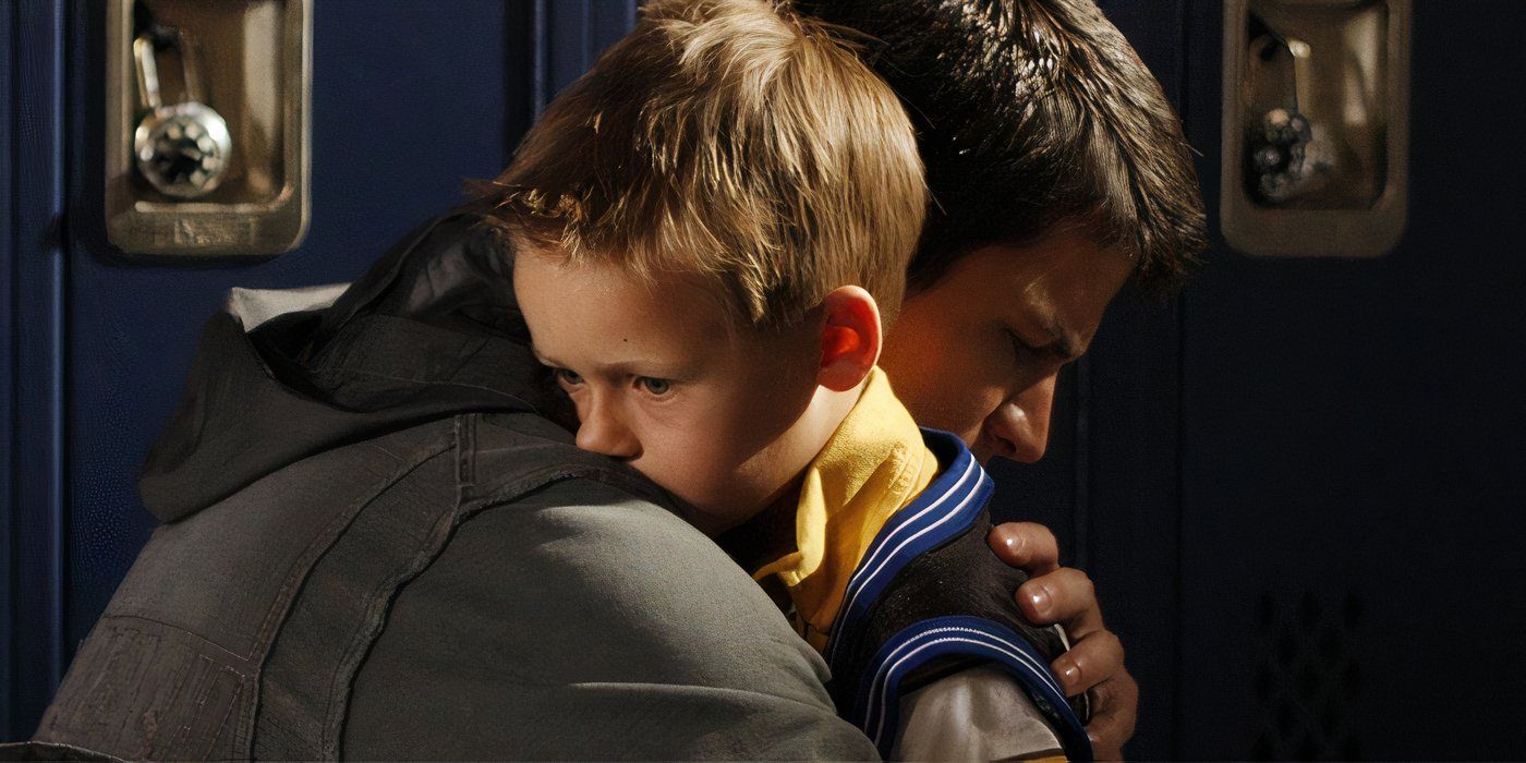 Closeup of James Lafferty hugging Jackson Brundage in 'One Tree Hill'