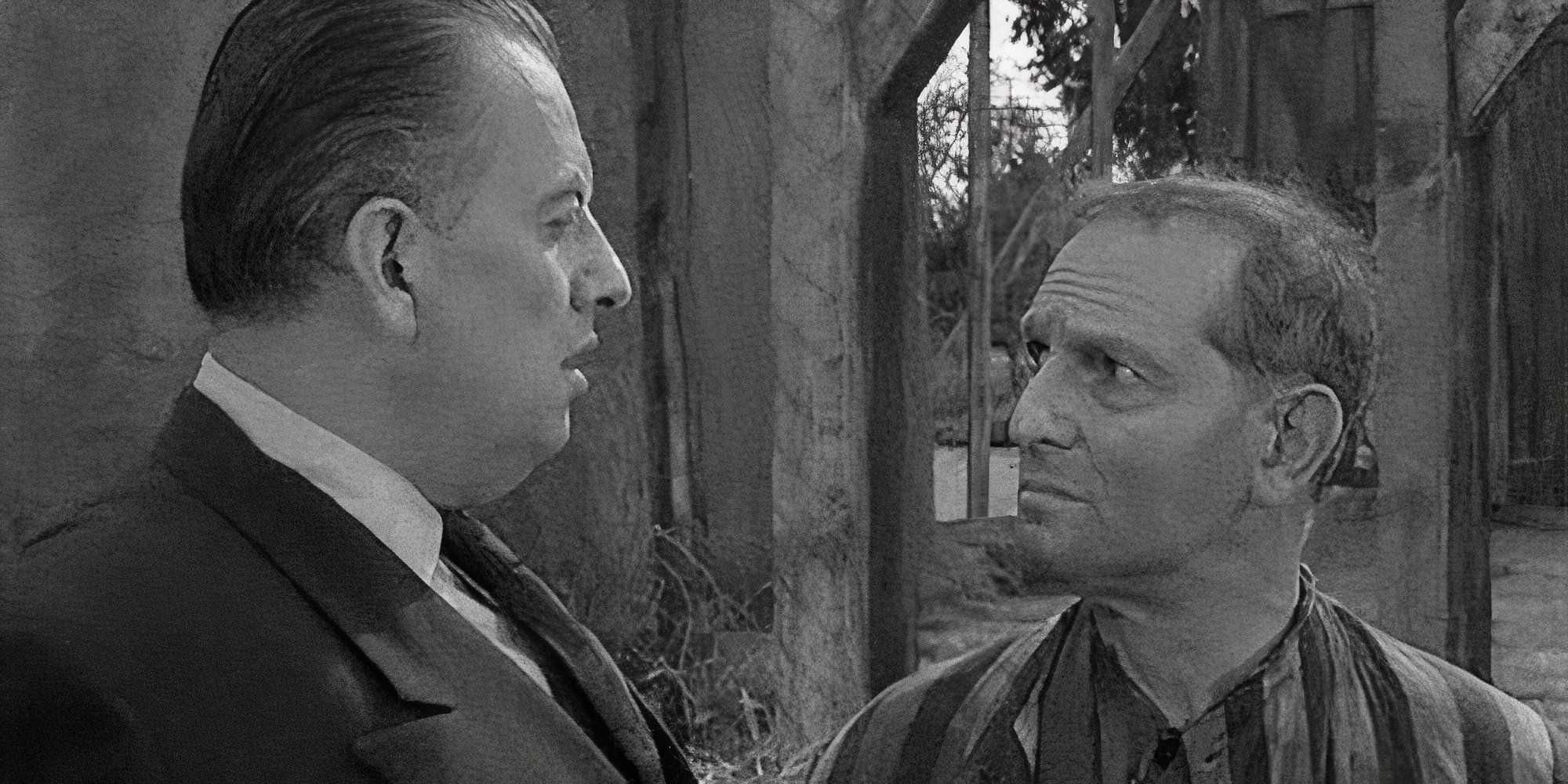 Oscar Beregi Jr. looking at Joseph Schildkraut standing next to him in The Twilight Zone