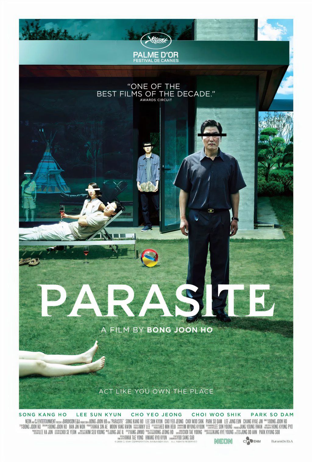 The Kim family lounges about in the backyard of the house of the Park family in the poster for Parasite. There is a sinister redacted line superimposed over every person’s eyes.