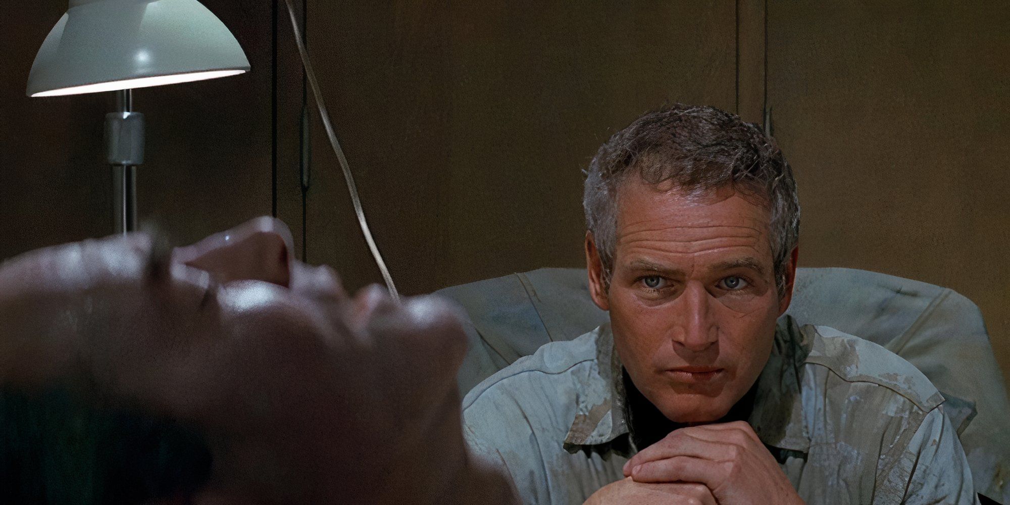 Paul Newman as Hank in Sometimes a Great Notion looking at a man