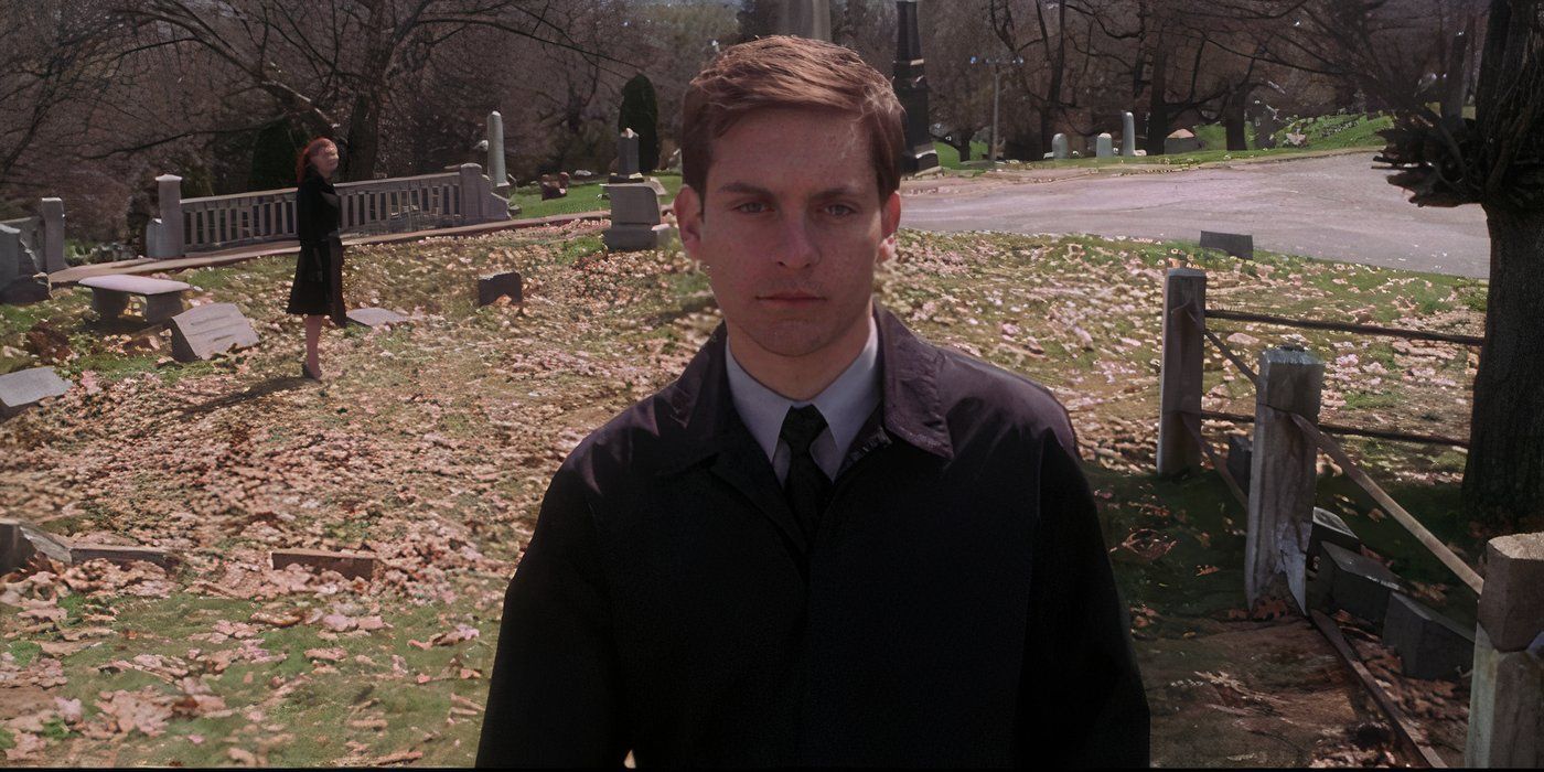 Peter Parker walking away from Mary Jane in a graveyard in Spider-Man 2002
