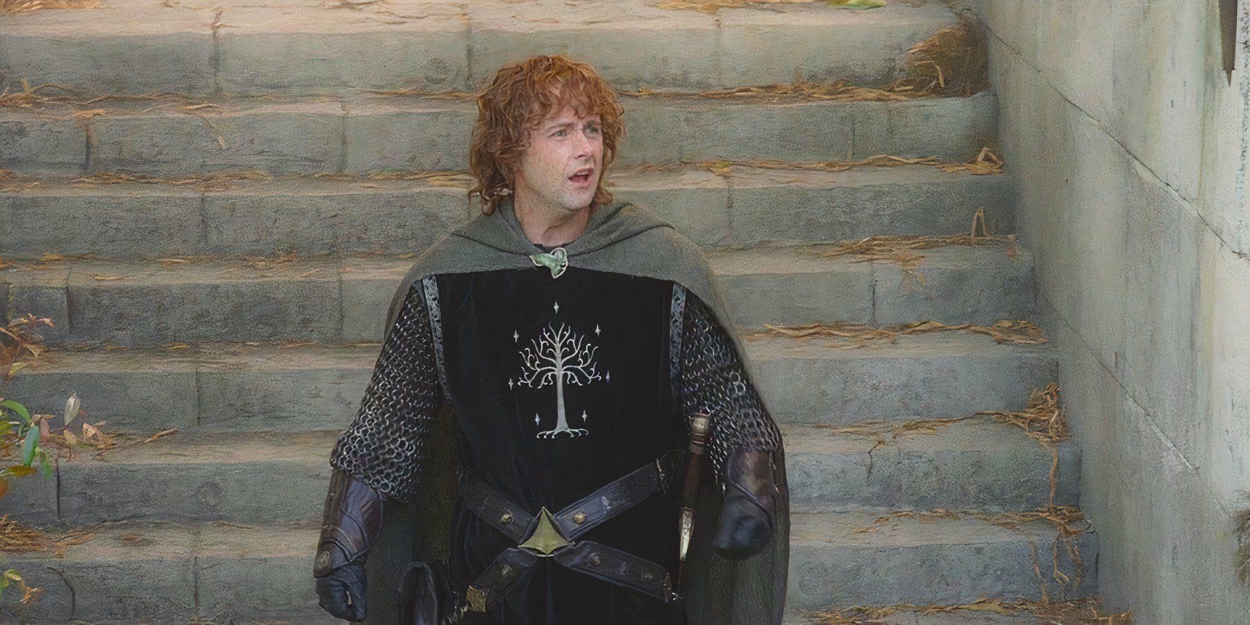 Young Hobbit Pippin, played by actor Billy Boyd, wears Gondorian armor as he meanders down stairs in The Lord of the Rings: The Return of the King.