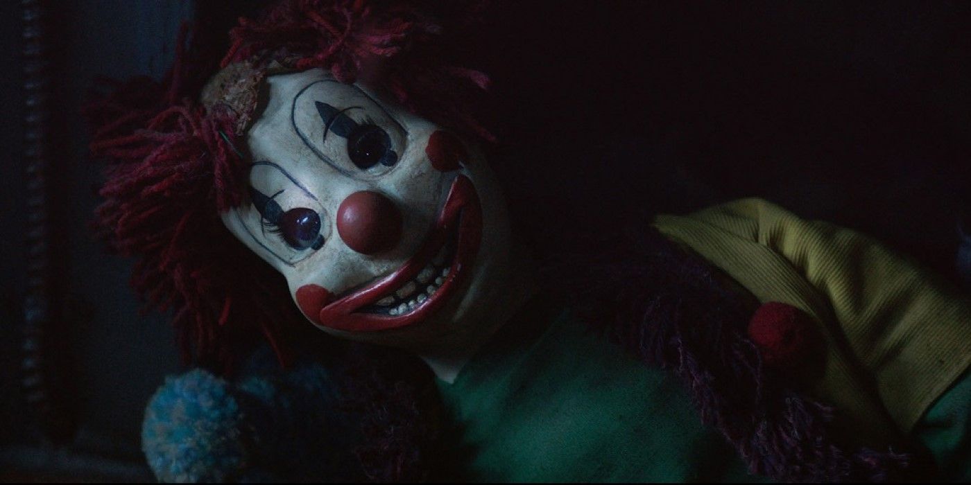 A creepy clown doll in 'Poltergeist' (2015)