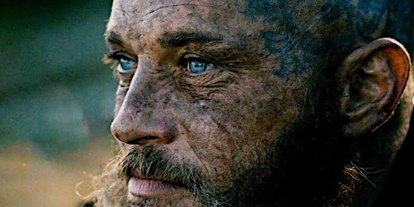 Travis Fimmell as Ragnar Lothbrok, dirty and looking into the distance