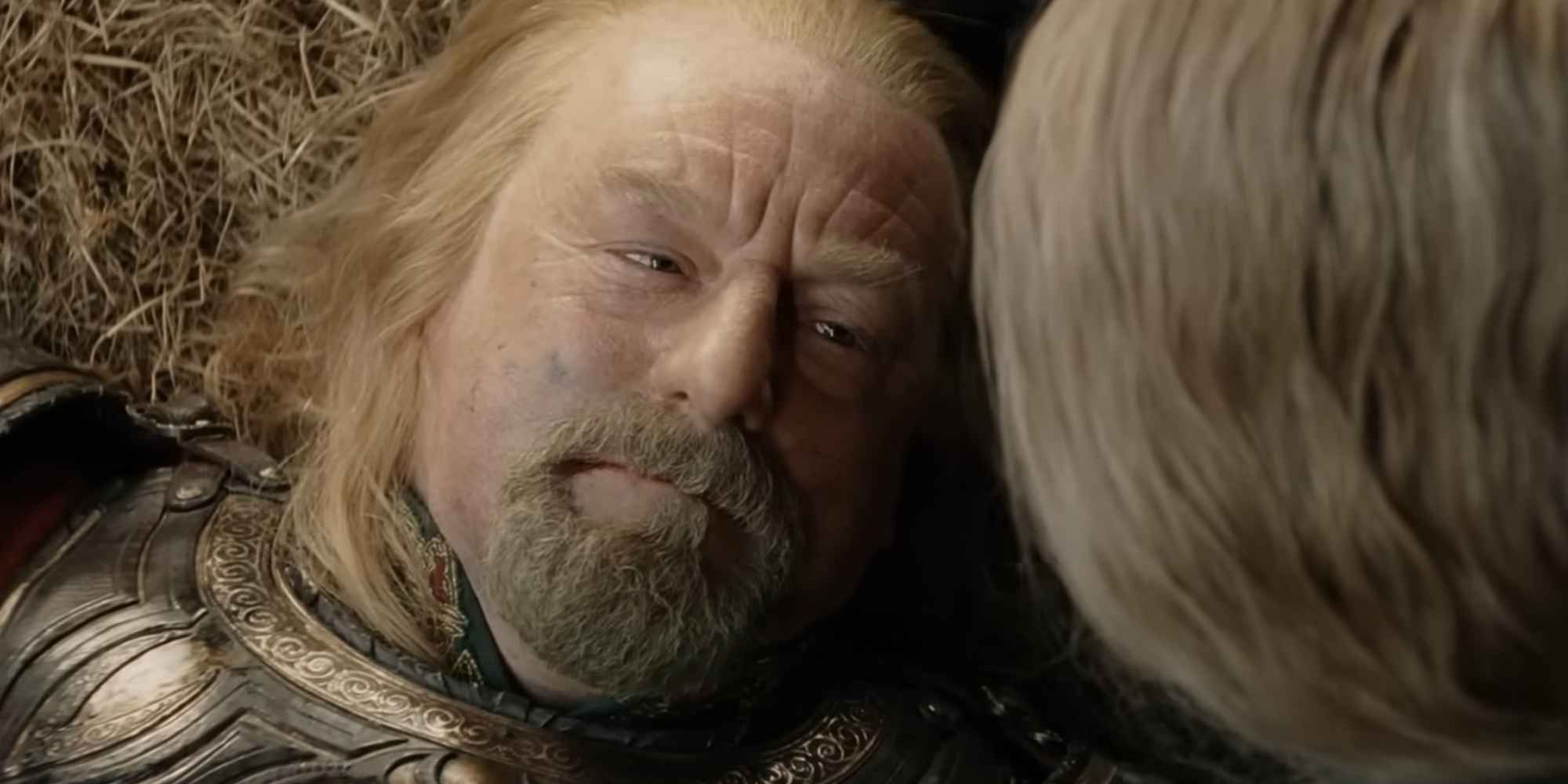 Theoden looks upon Eowyn during his final moments in The Lord of the Rings: The Return of the King