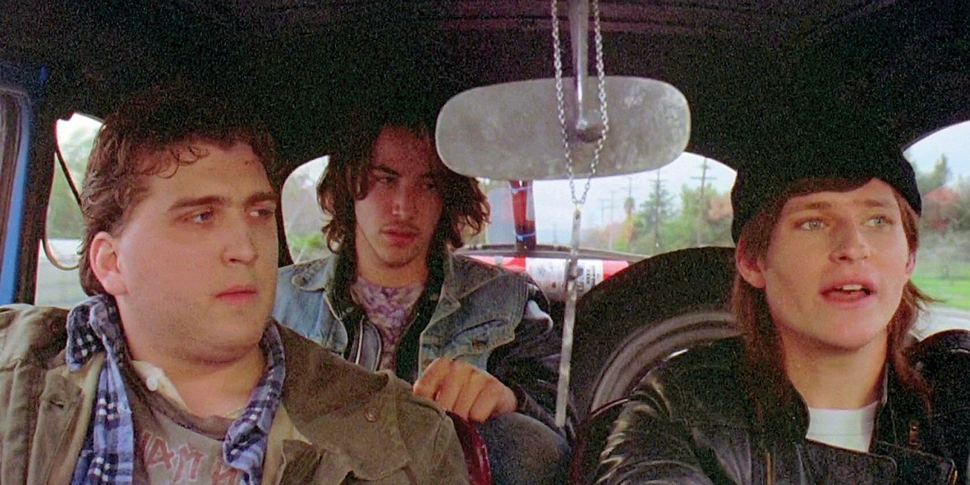 Daniel Roebuck as John, Keanu Reeves as Matt, and Crispin Glover as Layne driving around in River's Edge