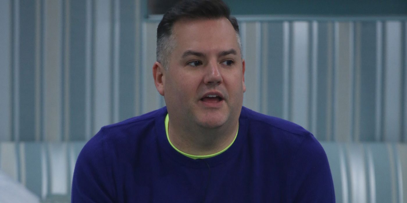 Ross Mathews sitting and leaning forward while talking in a scene from Celebrity Big Brother.