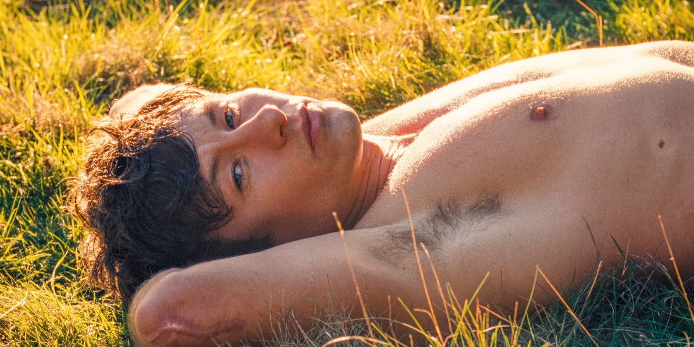 Barry Keoghan's Oliver Quick in Saltburn laying in the grass.