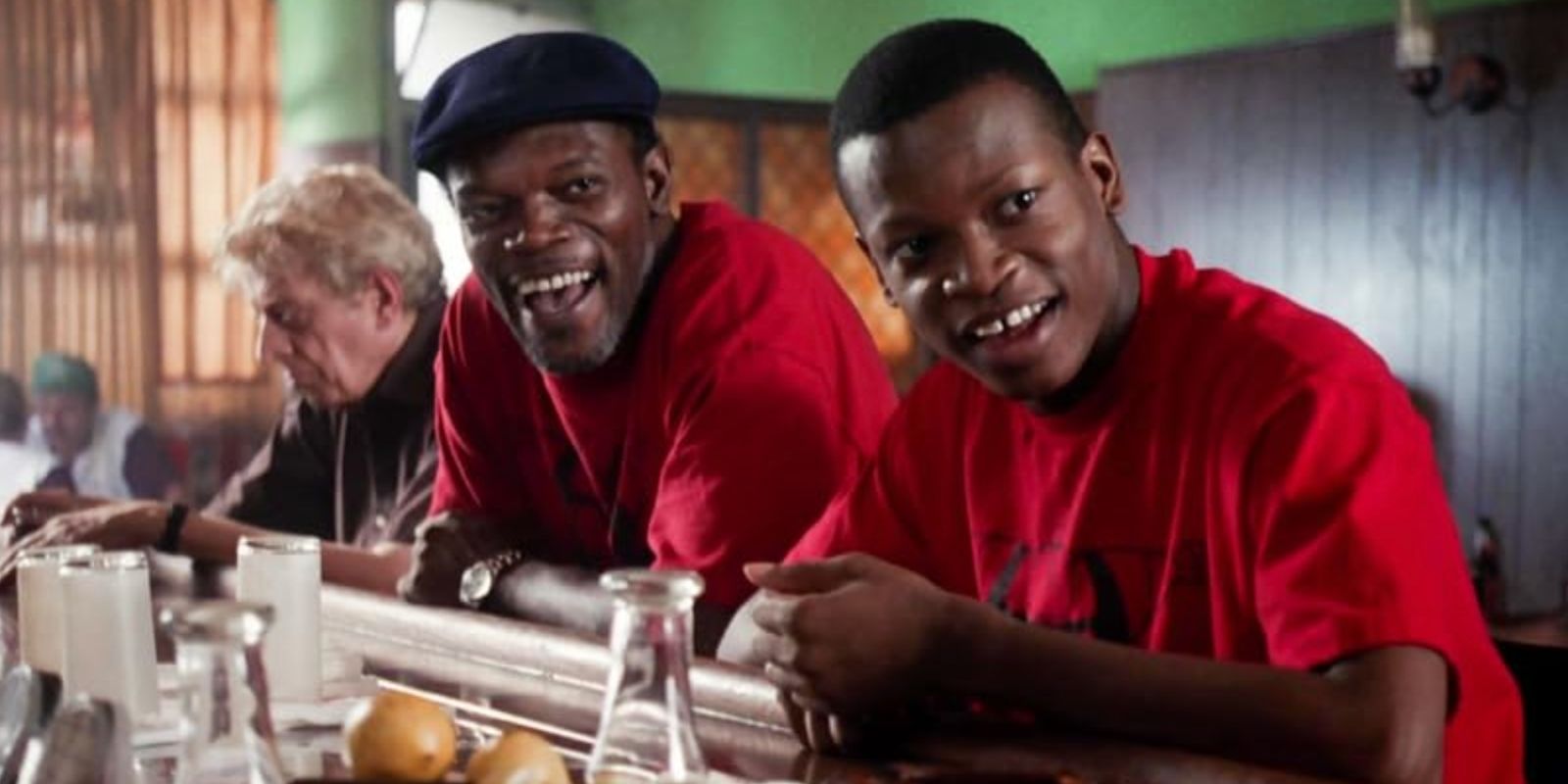 Samuel L. Jackson as Wendell and Larry Gilliard Jr. as James smiling in matching shirts in Trees Lounge