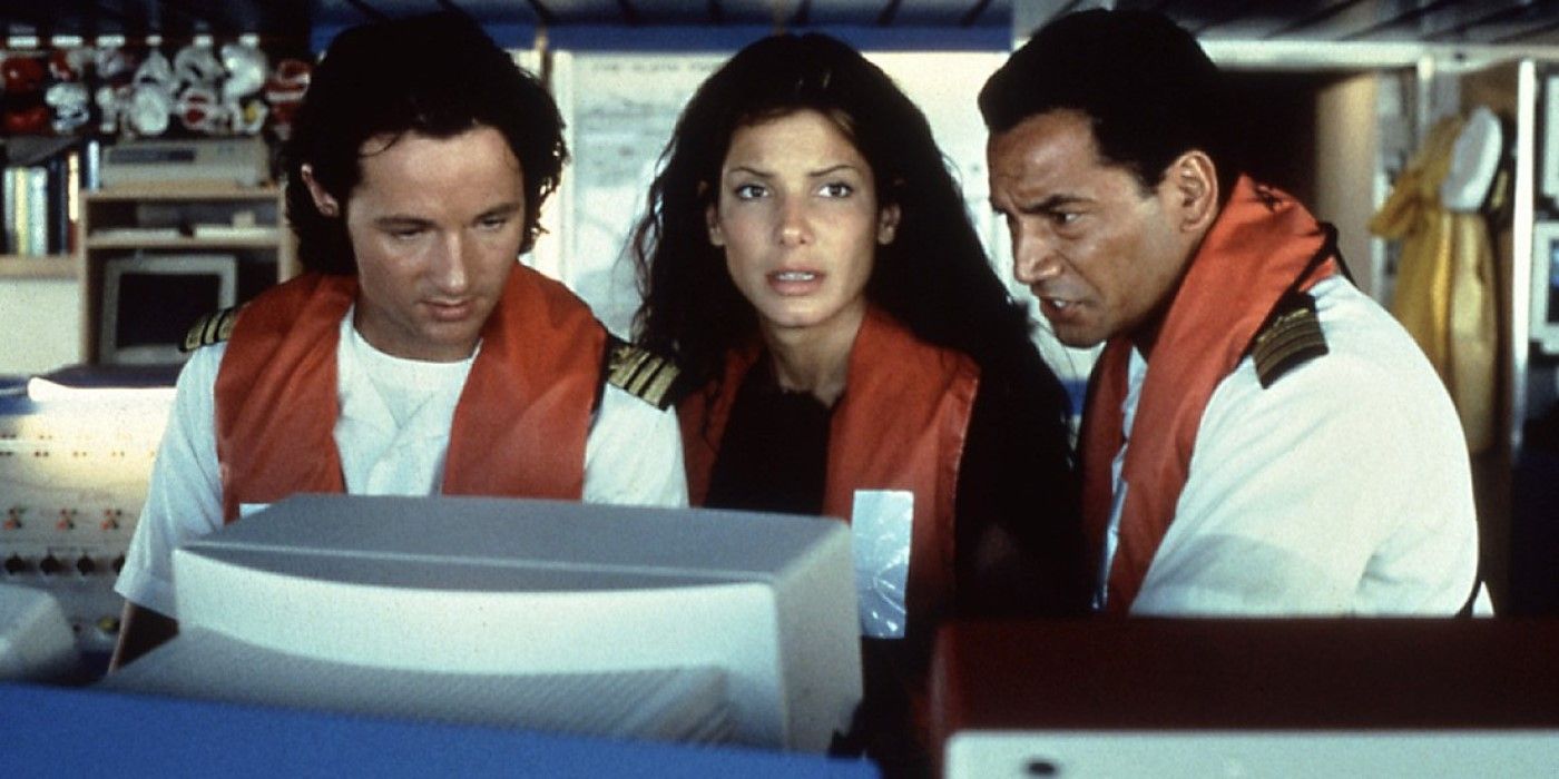 Sandra Bullock stands at the helm of a cruise ship as she looks out onto the open water in a scene from Speed 2: Cruise Control