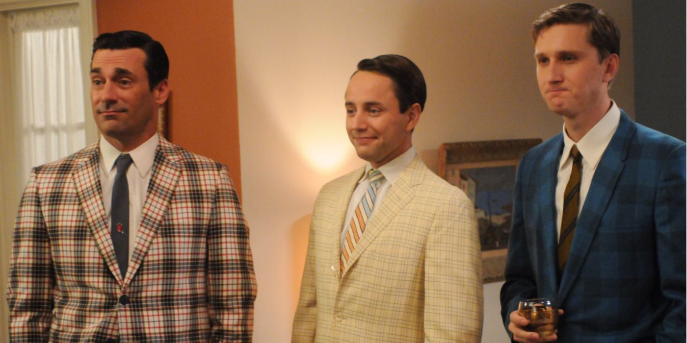 Jon Hamm, Vincent Kartheiser and Aaron Staton as Don, Pete, and Ken all wearing checkered suits standing in the living room in 'Mad Men'