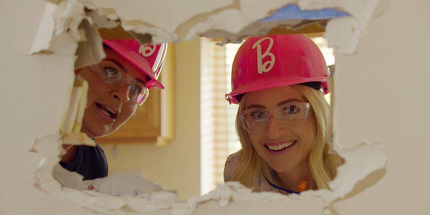 Jasmine Roth peeks through a hole in the drywall on the 'Barbie Dreamhouse Challenge'