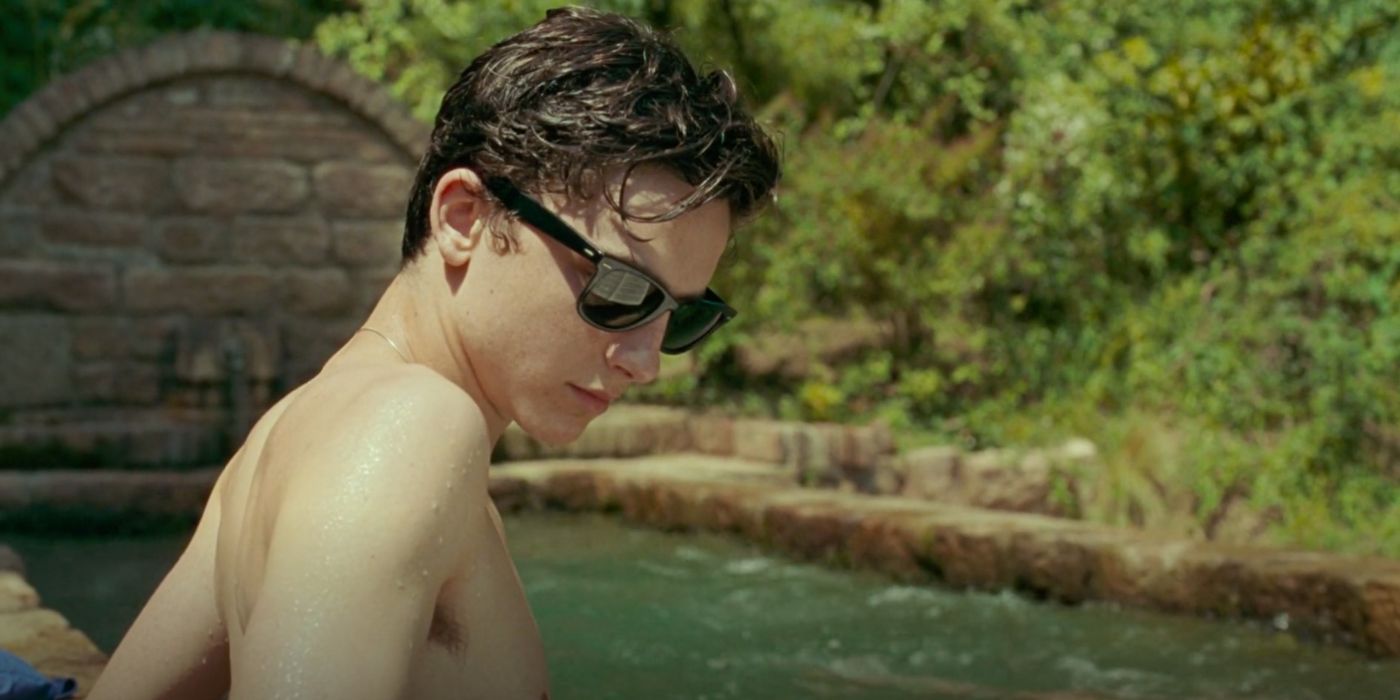 Elio (Timothée Chalamet) hangs out by the garden pool in Call Me by Your Name (2017).