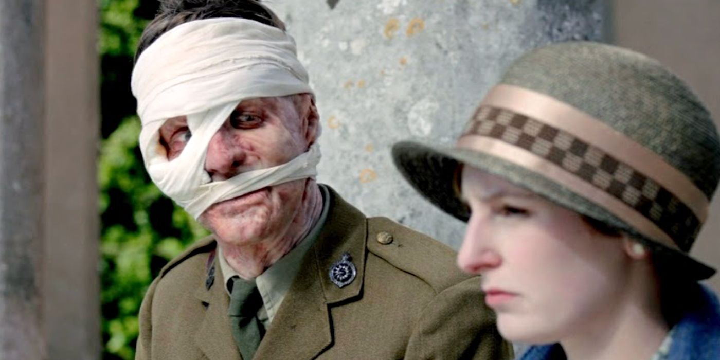 Trevor White as Patrick Gordon, sitting with his face heavily bandaged next to Edith Crawley (Laura Carmichael) in Downton Abbey