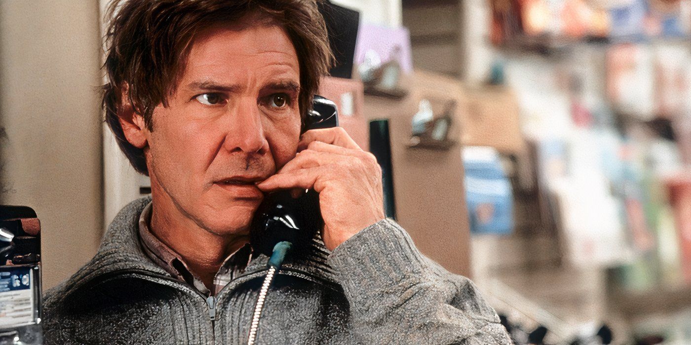 Harrison Ford as Richard Kimble, talking on a payphone and wearing a grey sweater in The Fugitive