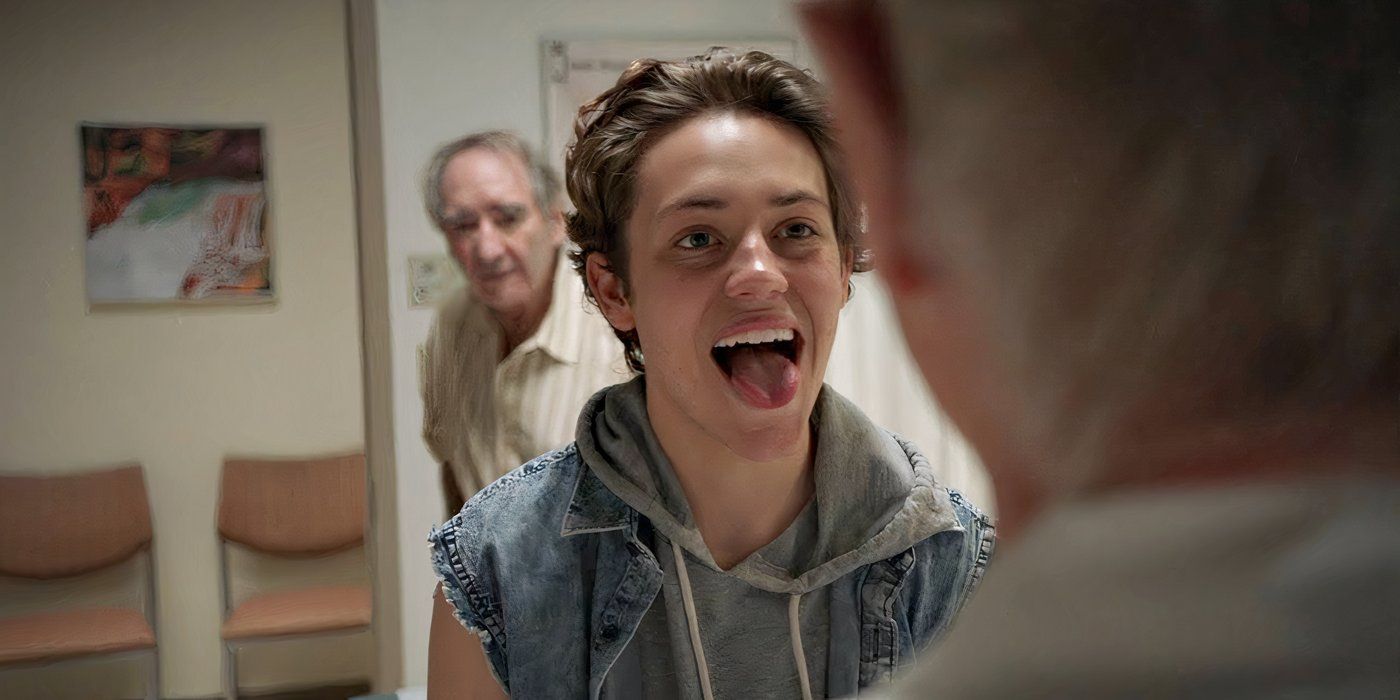 Ethan Cutkosky as Carl Gallagher, wearing a denim vest, sticking his tongue out and smiling on Shameless