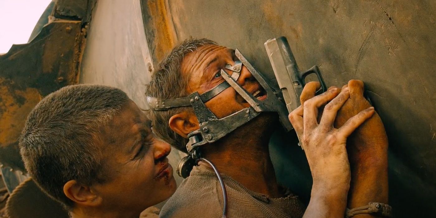 Furiosa (Charlize Theron) and Max (Tom Hardy) engage in a brutal fight in Mad Max: Fury Road (2015).