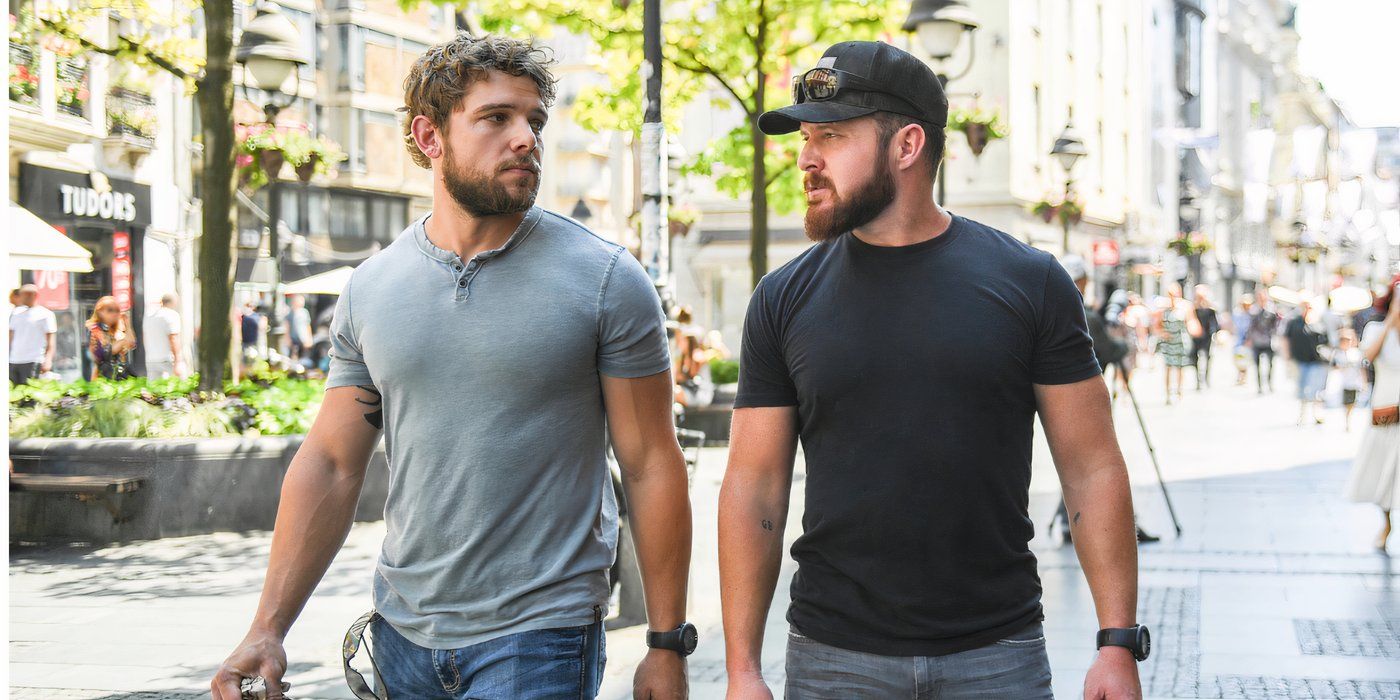 Max Thieriot and A.J. Buckley as Clay Spenser and Sonny Quinn, walking down a sunny street in SEAL Team