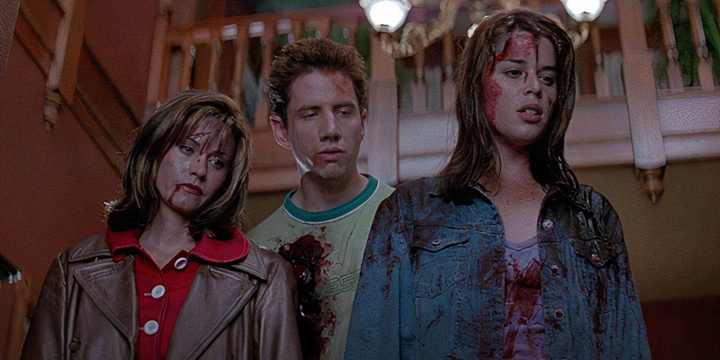 Courteney Cox, Jamie Kennedy, and Neve Campbell in the bloody ending of Scream (1996).