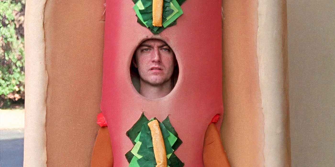 Sean Gunn as Kirk Gleason, dressed in a hot dog costume and looking sad on Gilmore Girls